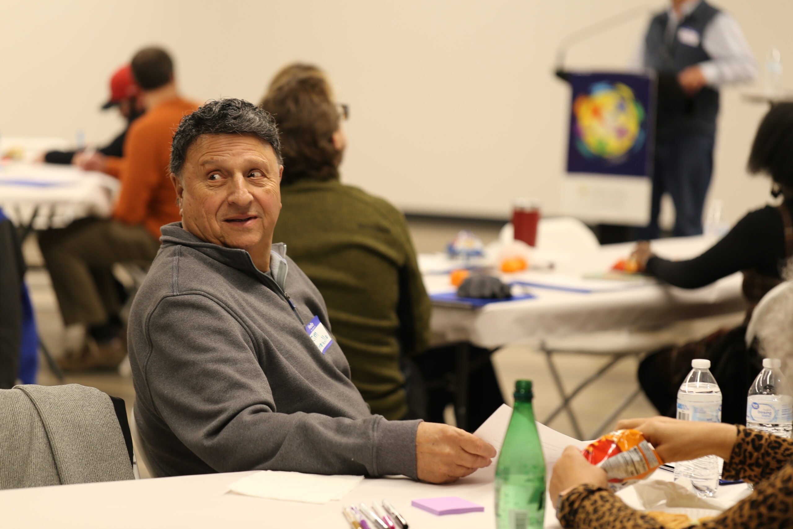 Jim Ronquillo sitting at table