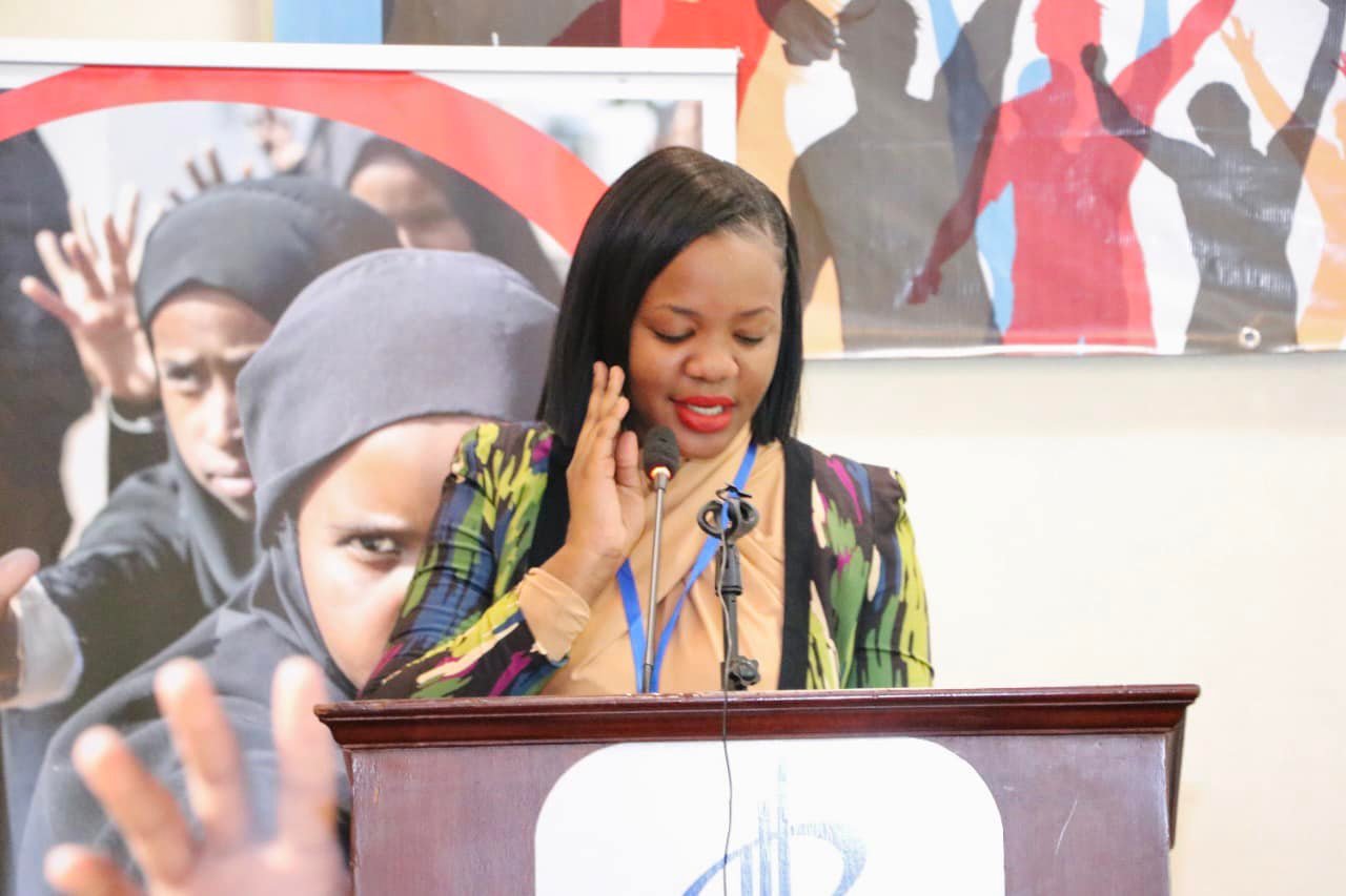 Sylvia speaking at the podium
