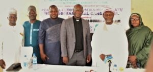 GPF Nigeria Country Director Rev. John Joseph Hayab (center) with other speakers at a forum on peaceful elections