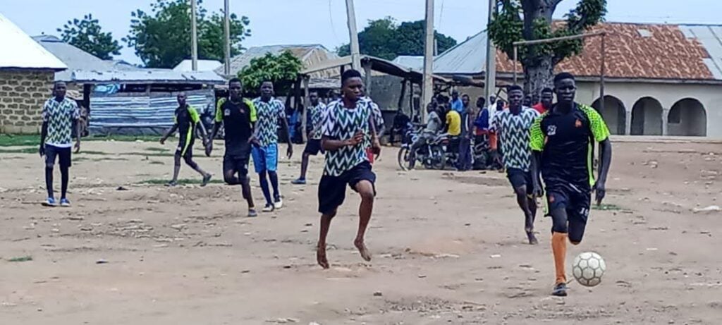 Nigerian football players come together for peacebuilding sports event.