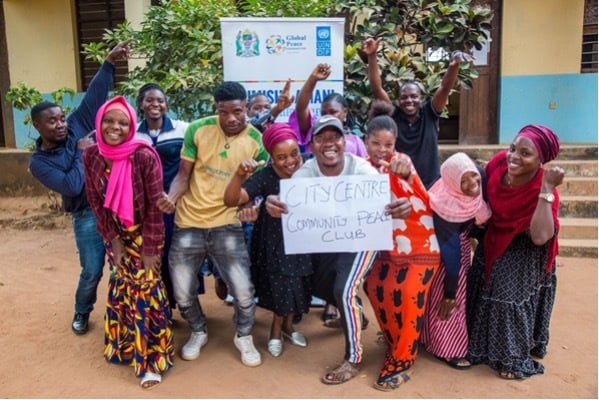 A group of Tanzanian youth engaging in peacebuilding activities.