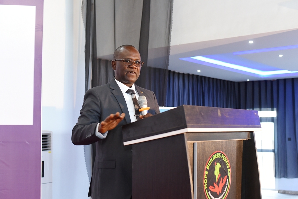 At the Nigeria 2023 Youth Festival, a man delivers an impactful speech from the podium.