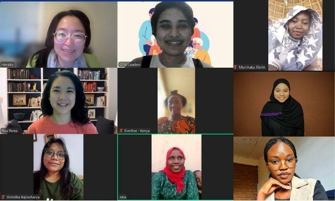 A screenshot of a virtual meeting with nine women, each in their own video box, some smiling, representing Young Leaders of Global Peace Women against various backgrounds.